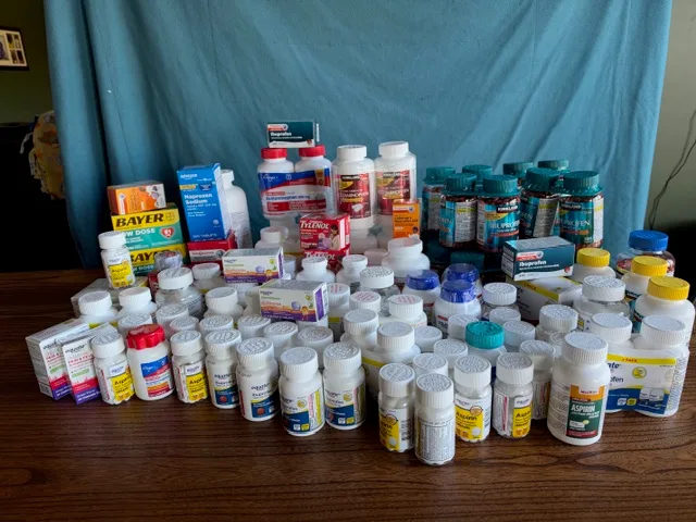Bottles and boxes of Tylenol, ibuprofen, naproxen, and aspirin purchased by Three Timbers Church for the Healing Kadi mission trip.