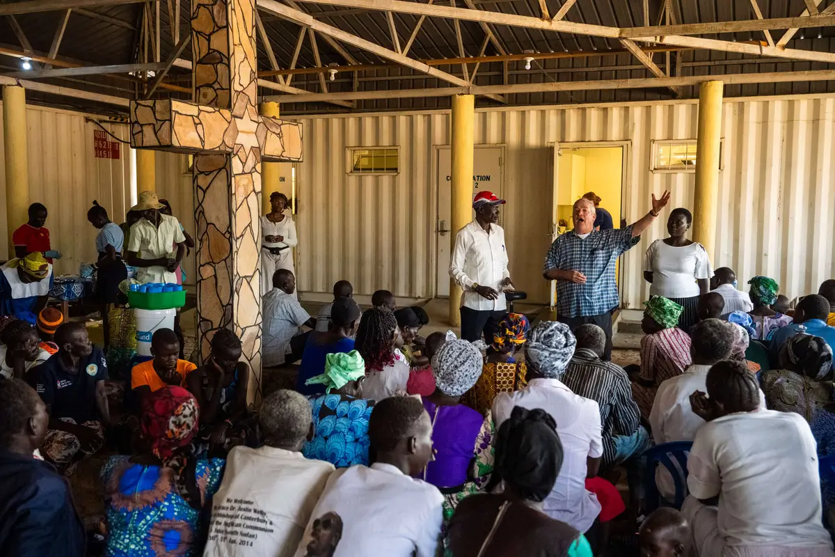 A Healing Kadi member preaching the Christian Faith to the Sudanese people.