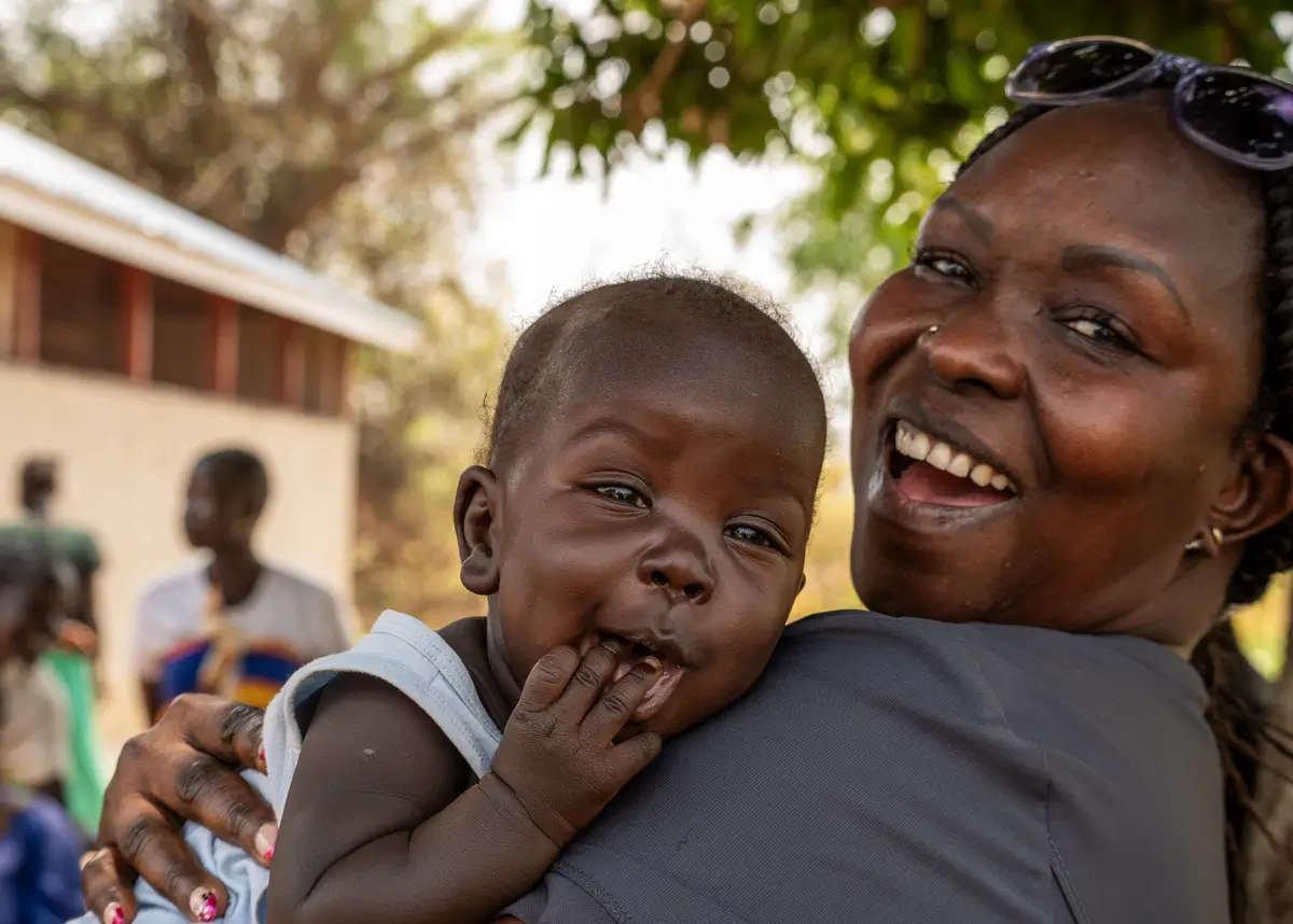 A doctor treating the wounds of a Sudanese man.